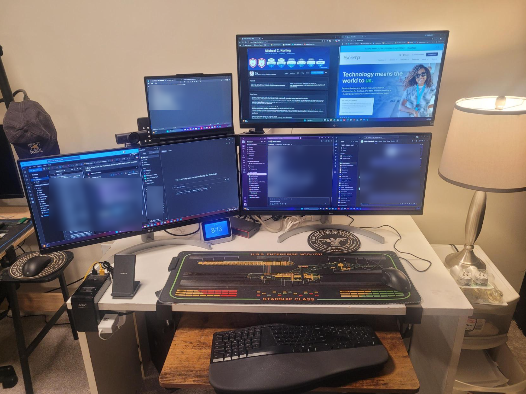 Actual workstation setup with Lenovo ThinkPad, USB4 Dock, and three LG ultrawide monitors